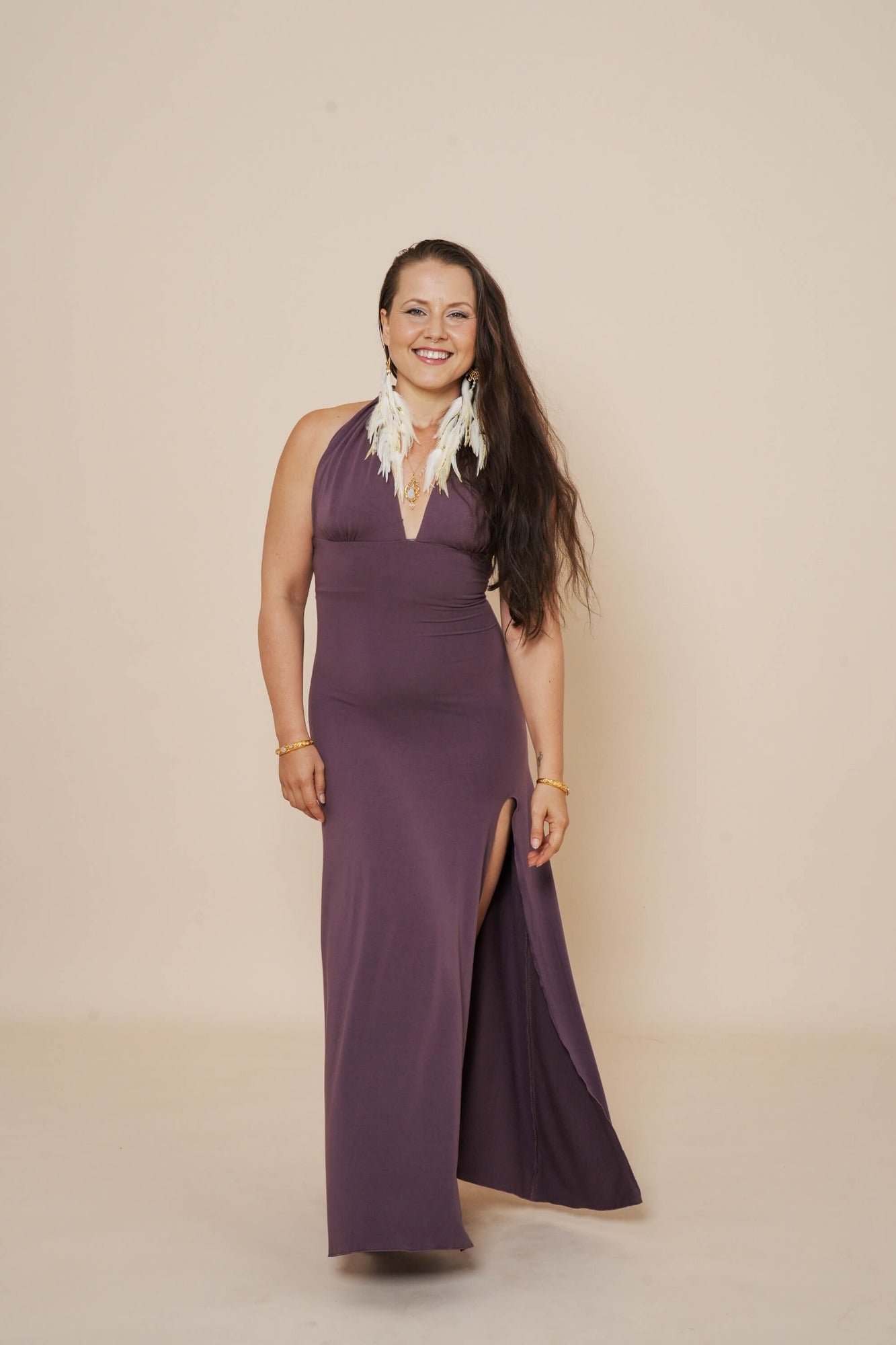 Beautiful long halter dress, with a side cut in eggplant.