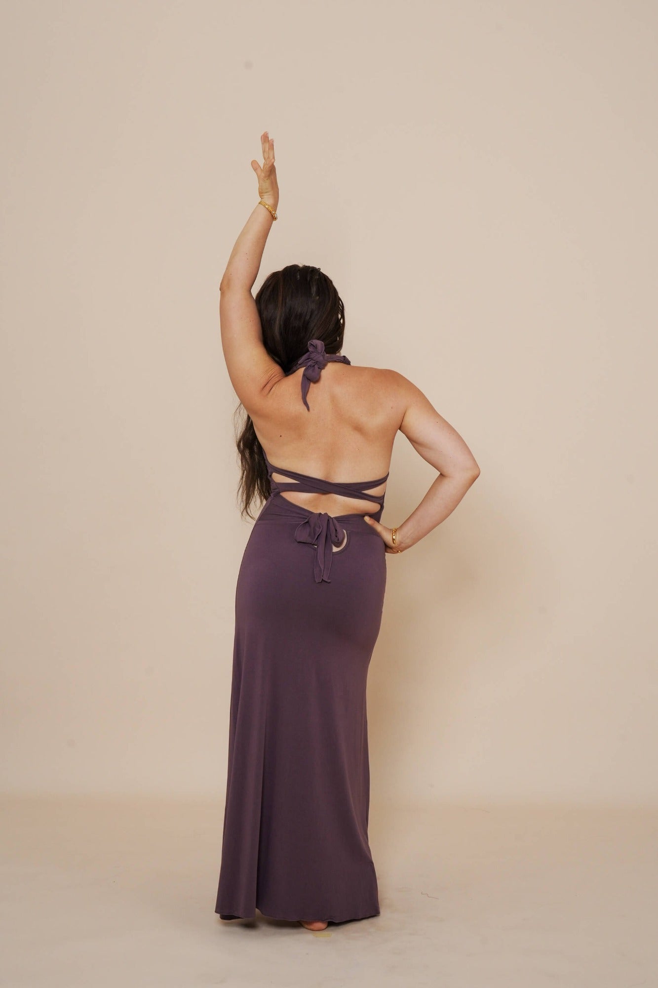 Beautiful long halter dress, with a side cut in eggplant.