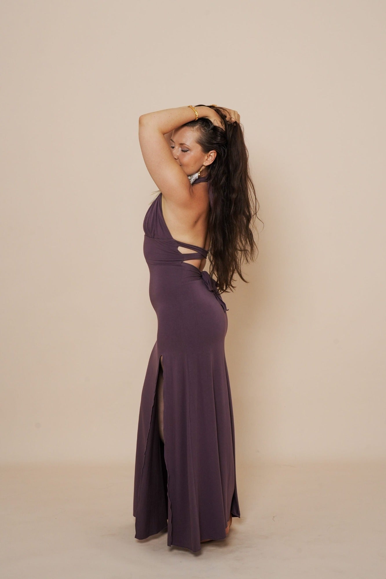 Beautiful long halter dress, with a side cut in eggplant.