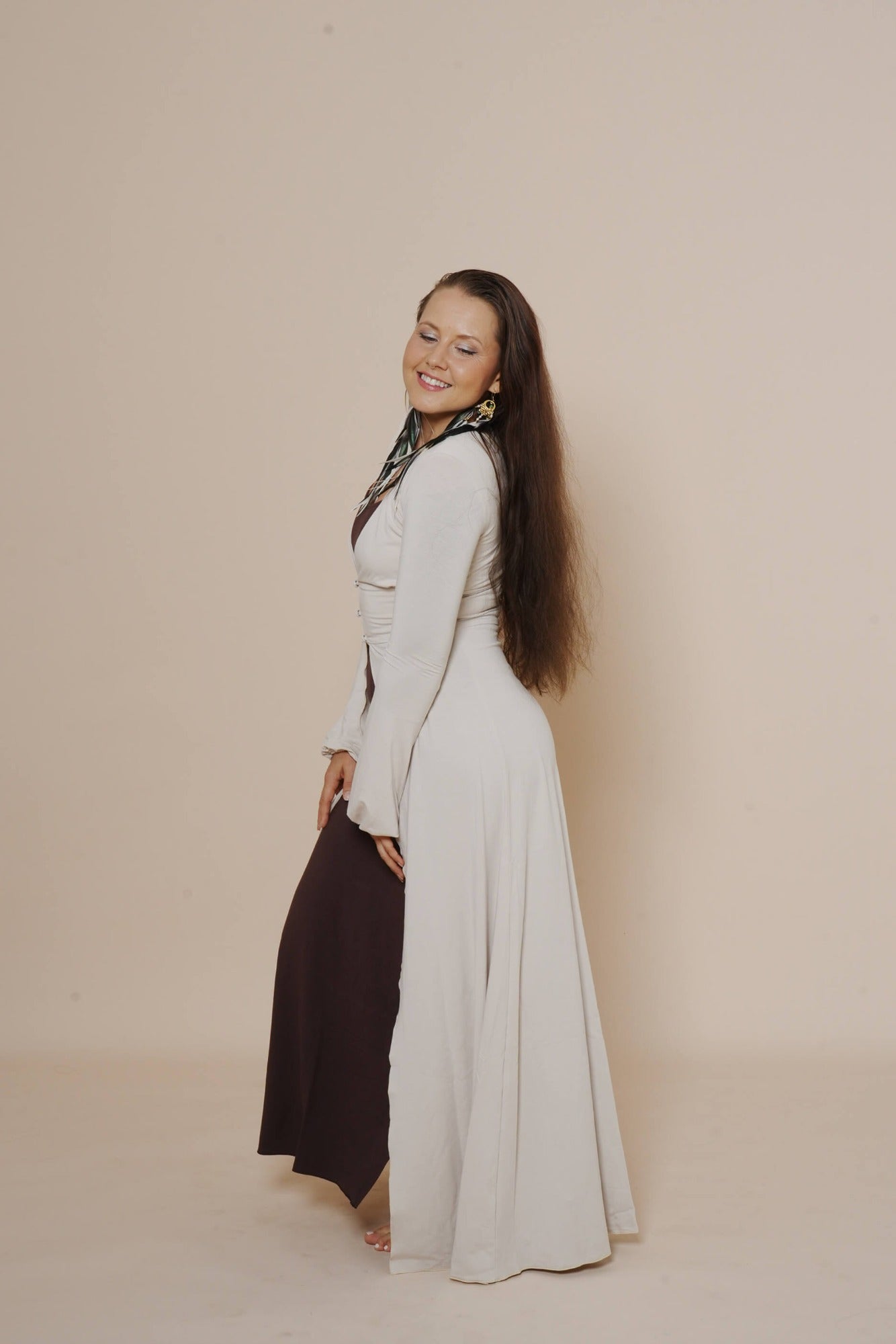 Long puffy sleeve vest combined with long brown dress.