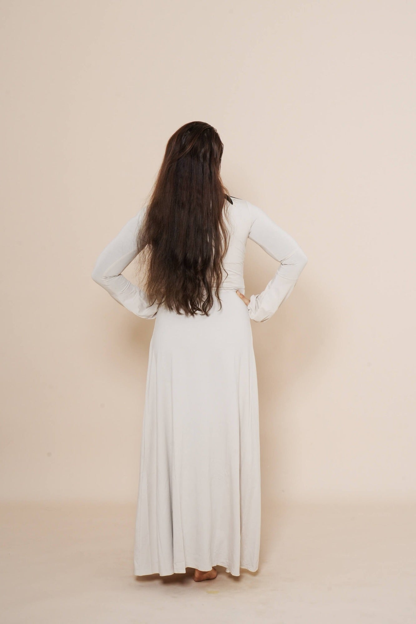Long puffy sleeve vest combined with long brown dress.