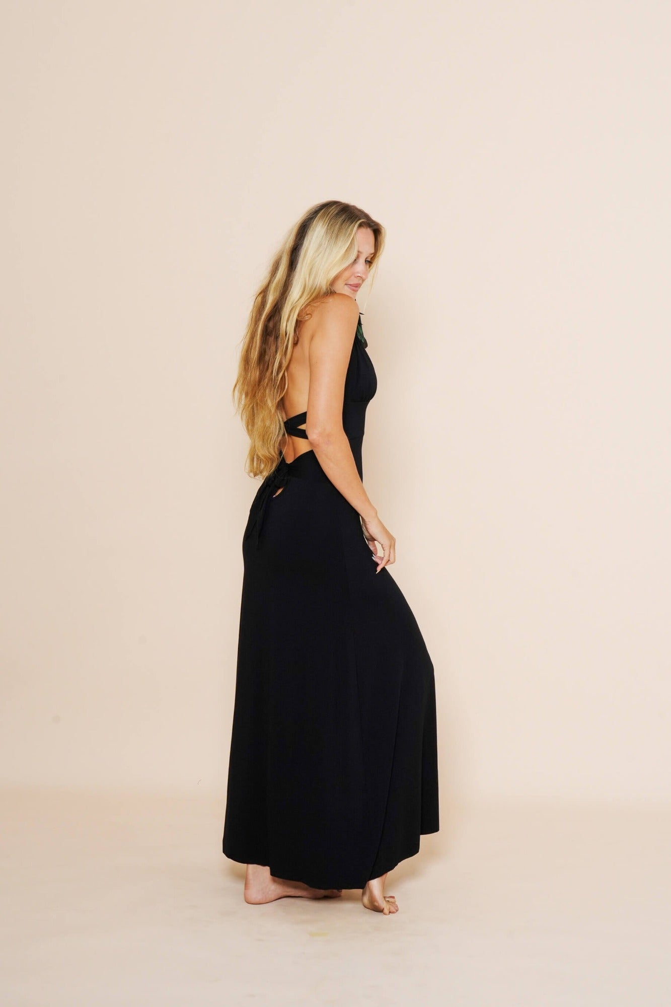 Beautiful long halter dress, with a side cut in black.