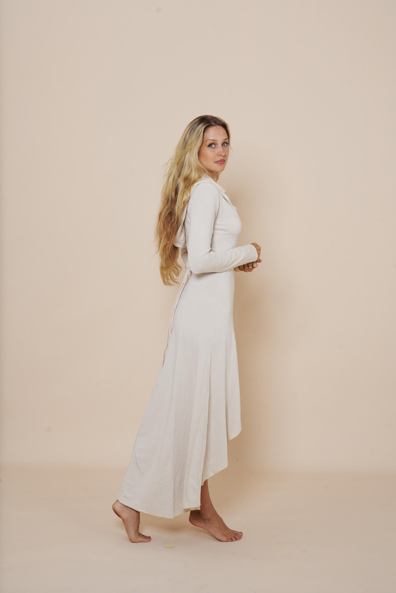 Beautiful long wrap around dress with hood in winter white.