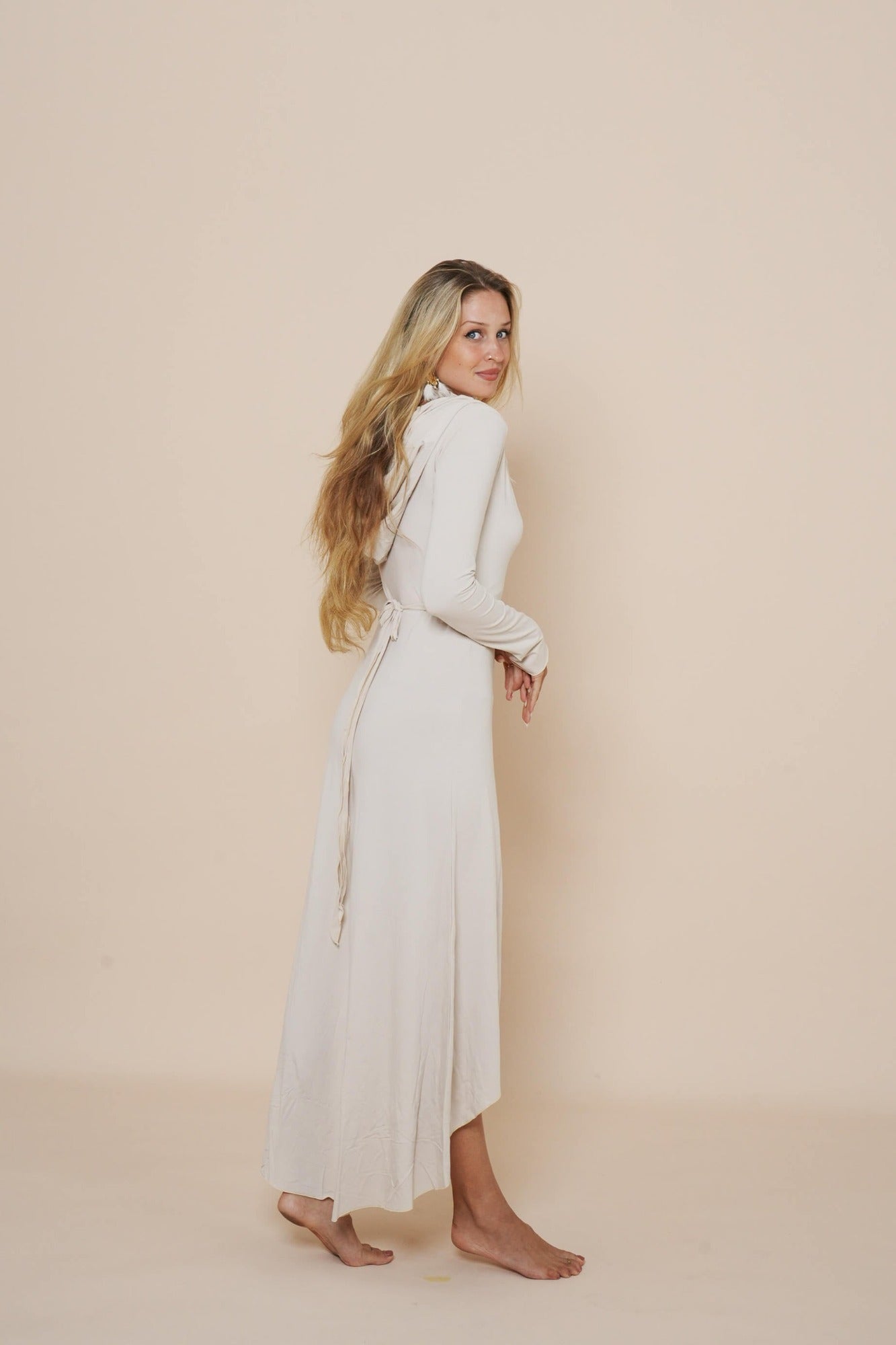 Beautiful long wrap around dress with hood in winter white.