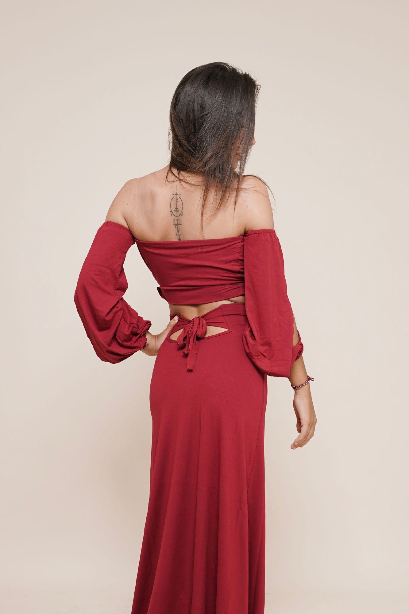 Cute skirt with bow in the back combined with our Liberate off shoulder puffy sleeve top by Bohemian Goddess I Color: Scarlett I www.bohemiangoddess.com