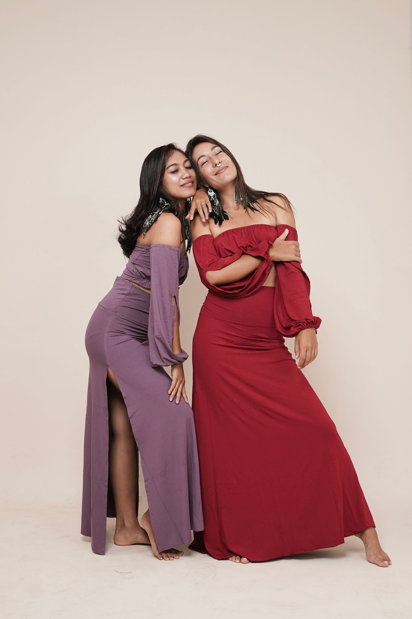 Goddess wear, women's designer clothing and fashion. Off shoulder puffy sleeve boho top named Liberate in color scarlet and purple eggplant with Enchanted skirt in color scarlet and Harmony skirt in color eggplant I www.bohemiangoddess.com