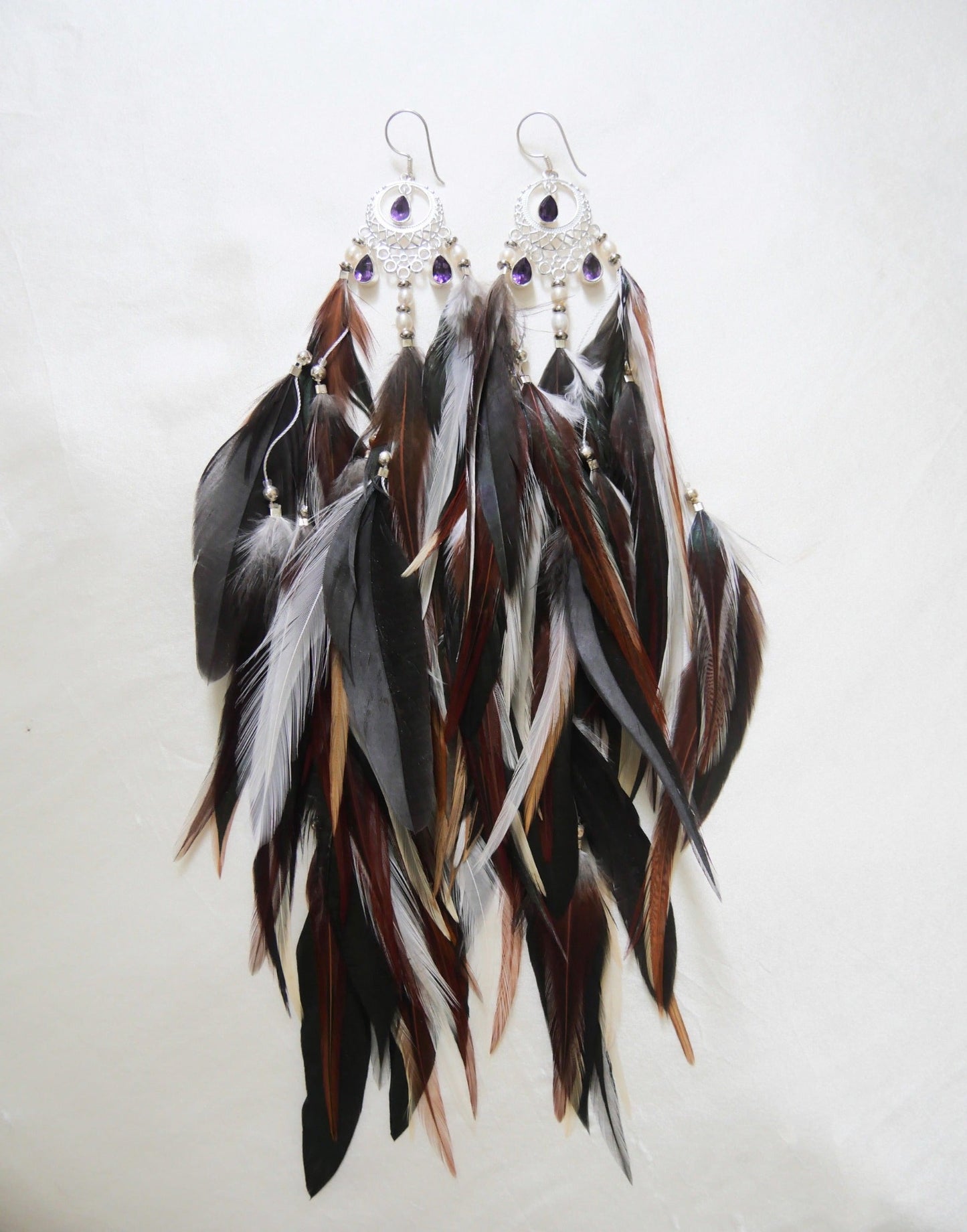 Bohemian Goddess long feather earrings named Connected To My Highest Self with mixed dark and reddish brown color feathers