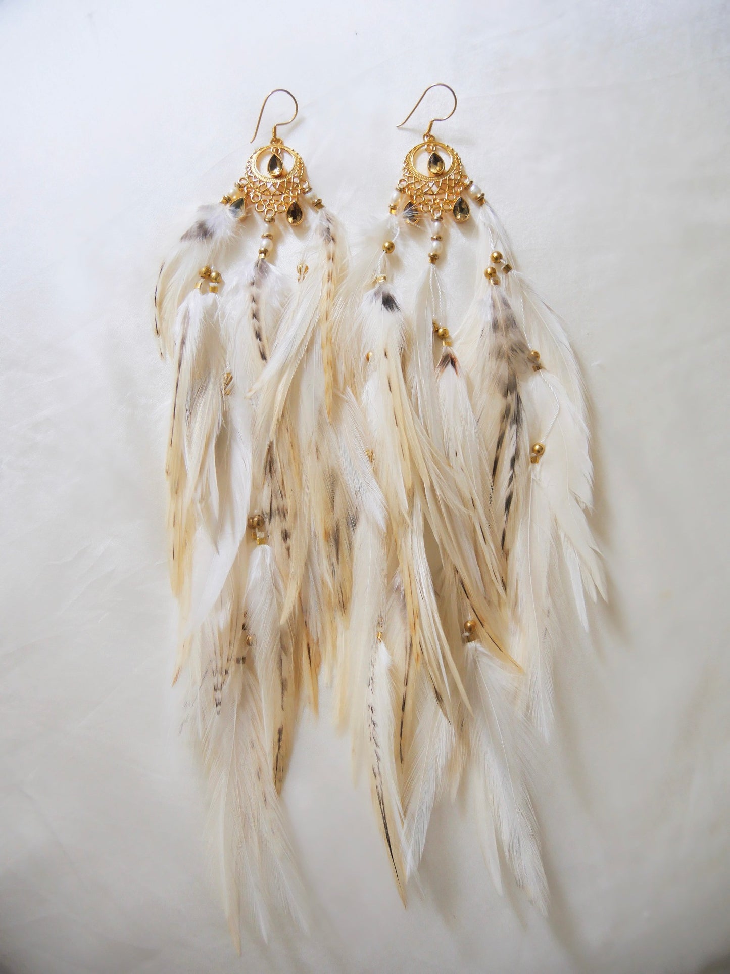 Bohemian Goddess earrings named My Inner Burning Fire with citrine crystals yellow creamy and patterned feathers from Bohemian Goddess brand.