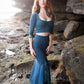 Mermaid lace -skirt and lace crop top in dark teal combined with black feather earrings. 