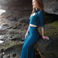 Mermaid lace -skirt and lace crop top in dark teal combined with black feather earrings. 