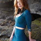 Mermaid lace -skirt and lace crop top in dark teal combined with black feather earrings. 