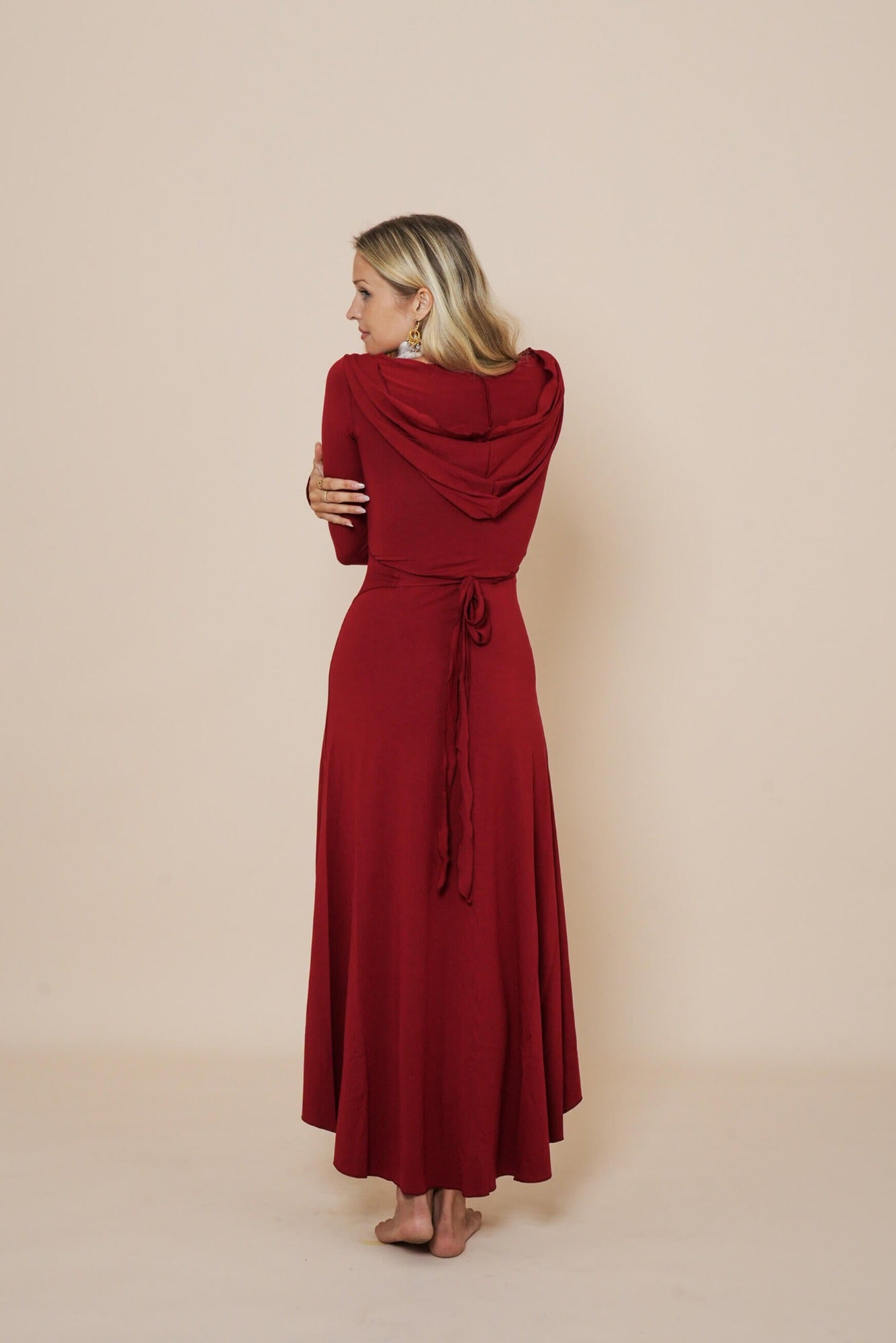 Beautiful long wrap around dress with hood in color scarlet red.