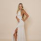 Beautiful long halter dress, with a side cut in color winter white.