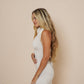 Beautiful long halter dress, with a side cut in color winter white.