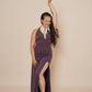 Beautiful long halter dress, with a side cut in color eggplant.