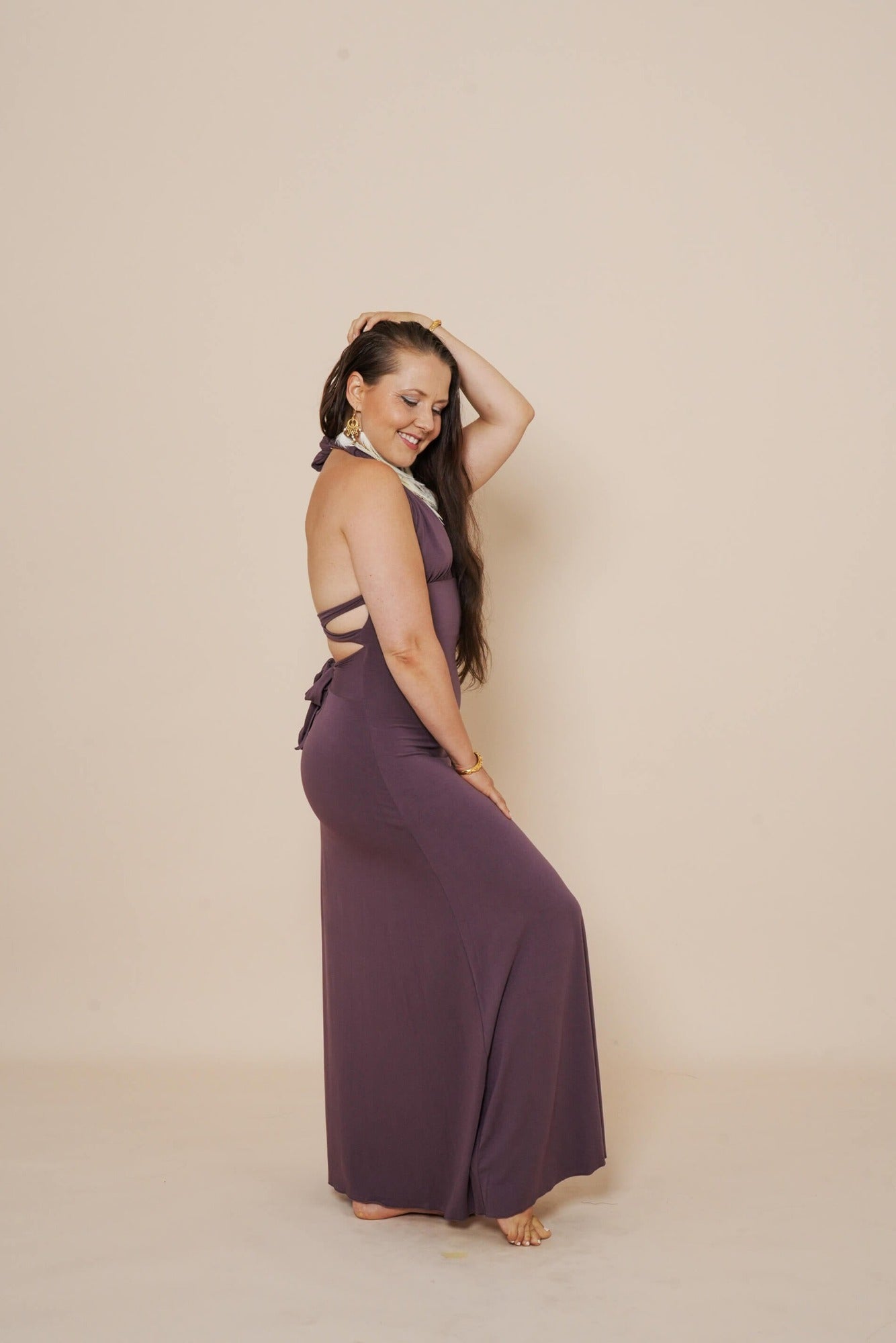 Beautiful long halter dress, with a side cut in eggplant.