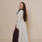 Long puffy sleeve vest combined with long brown dress.