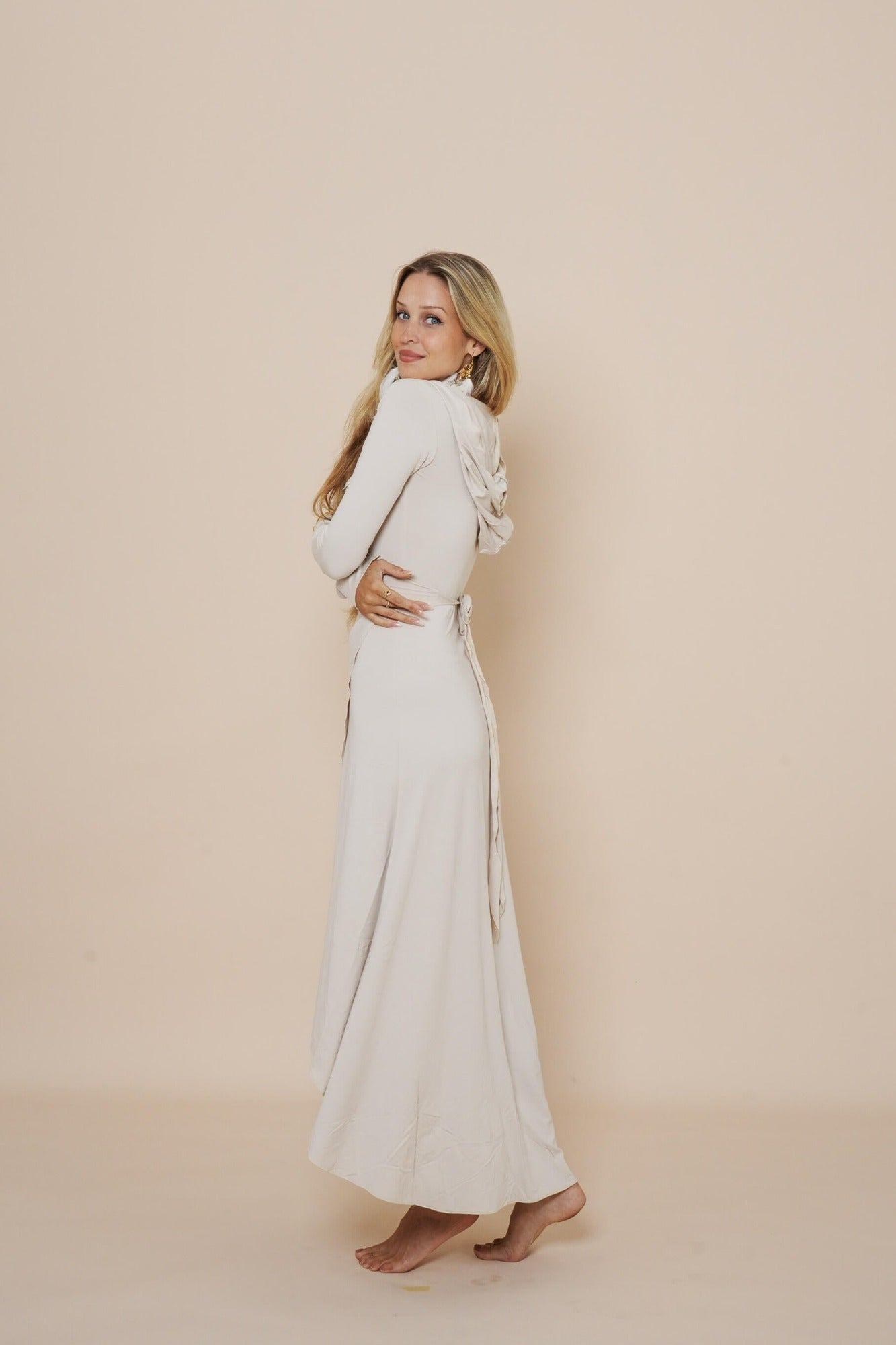 Beautiful long wrap around dress with hood in winter white.