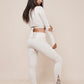 Charm off-shoulder wrap shirt winter white styled with leggings 1