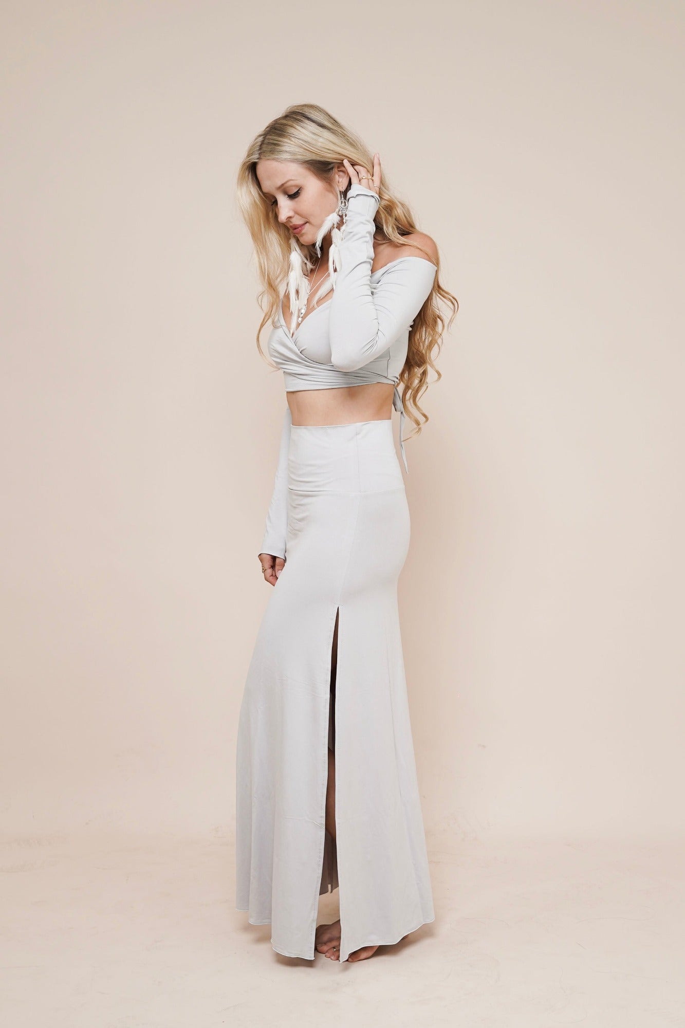 Side view of Charm wrap off shoulder shirt showing adjustable wrap design