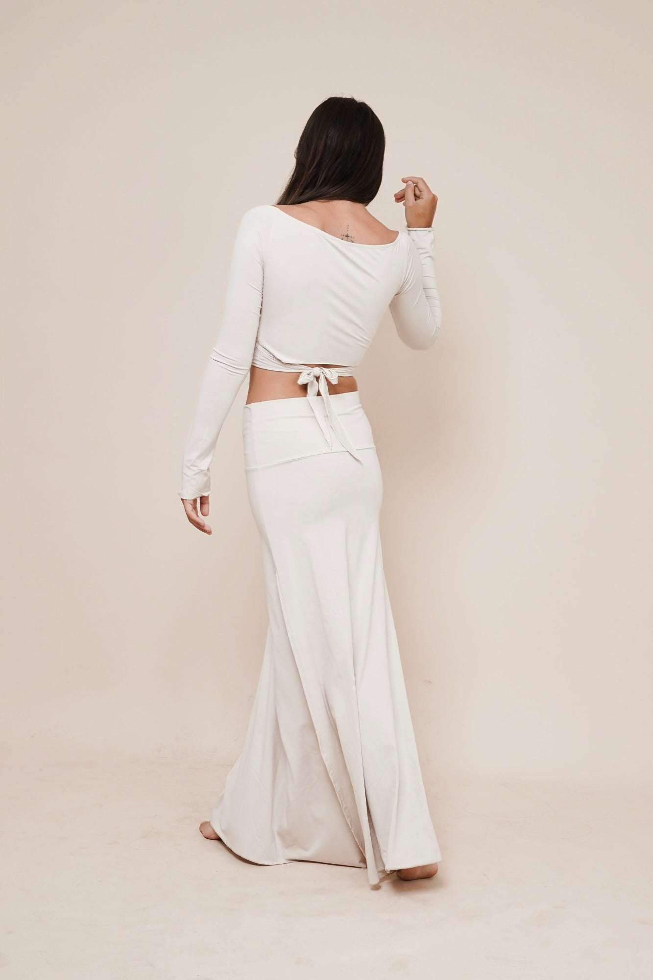 Charm off-shoulder wrap shirt styled with Harmony skirt in winter white back view