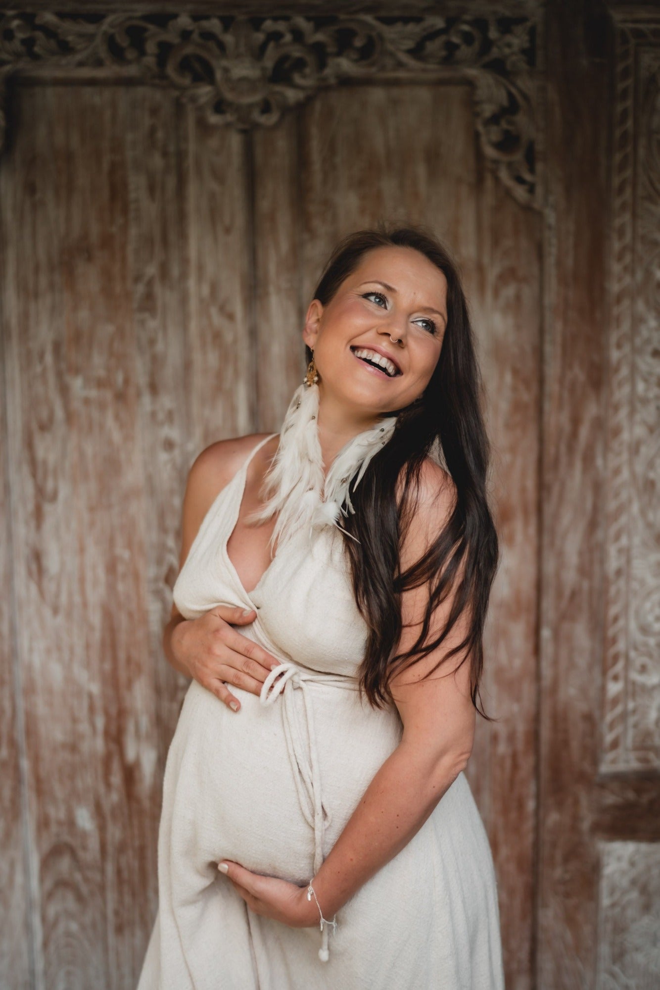 Long My Truth Sets Me Free blue topaz white feather earrings with gold plated moon charm on woman with brown long hair