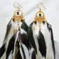 Bohemian Goddess long feather earrings with white and emerald green feathers, green quartz crystals and a gold plated brass moon chandelier.