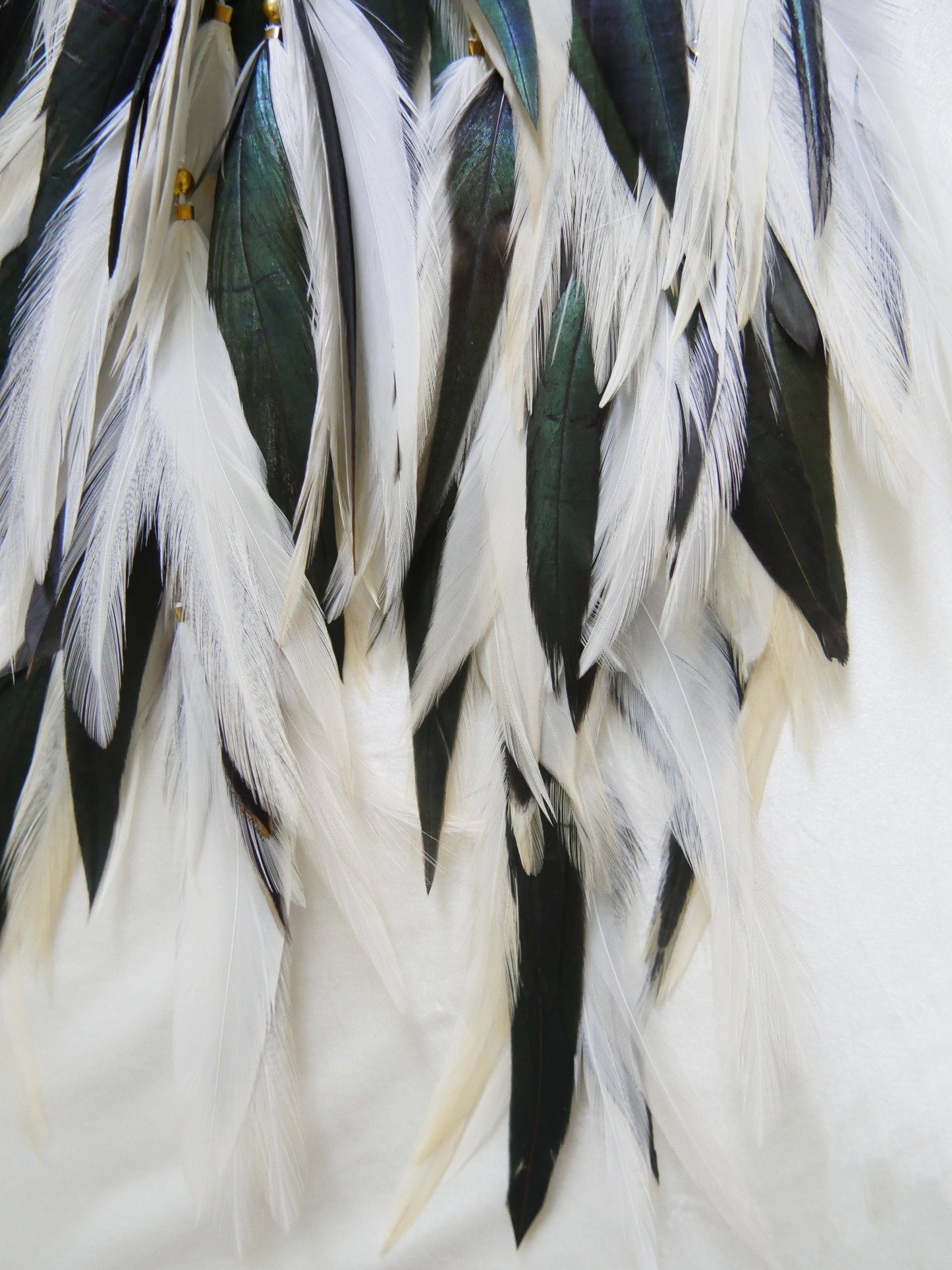 Bohemian Goddess long feather earrings with white and emerald green feathers, green quartz crystals.
