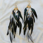 Bohemian Goddess long feather earrings with white and emerald green feathers, green quartz crystals and a gold plated brass moon chandelier.