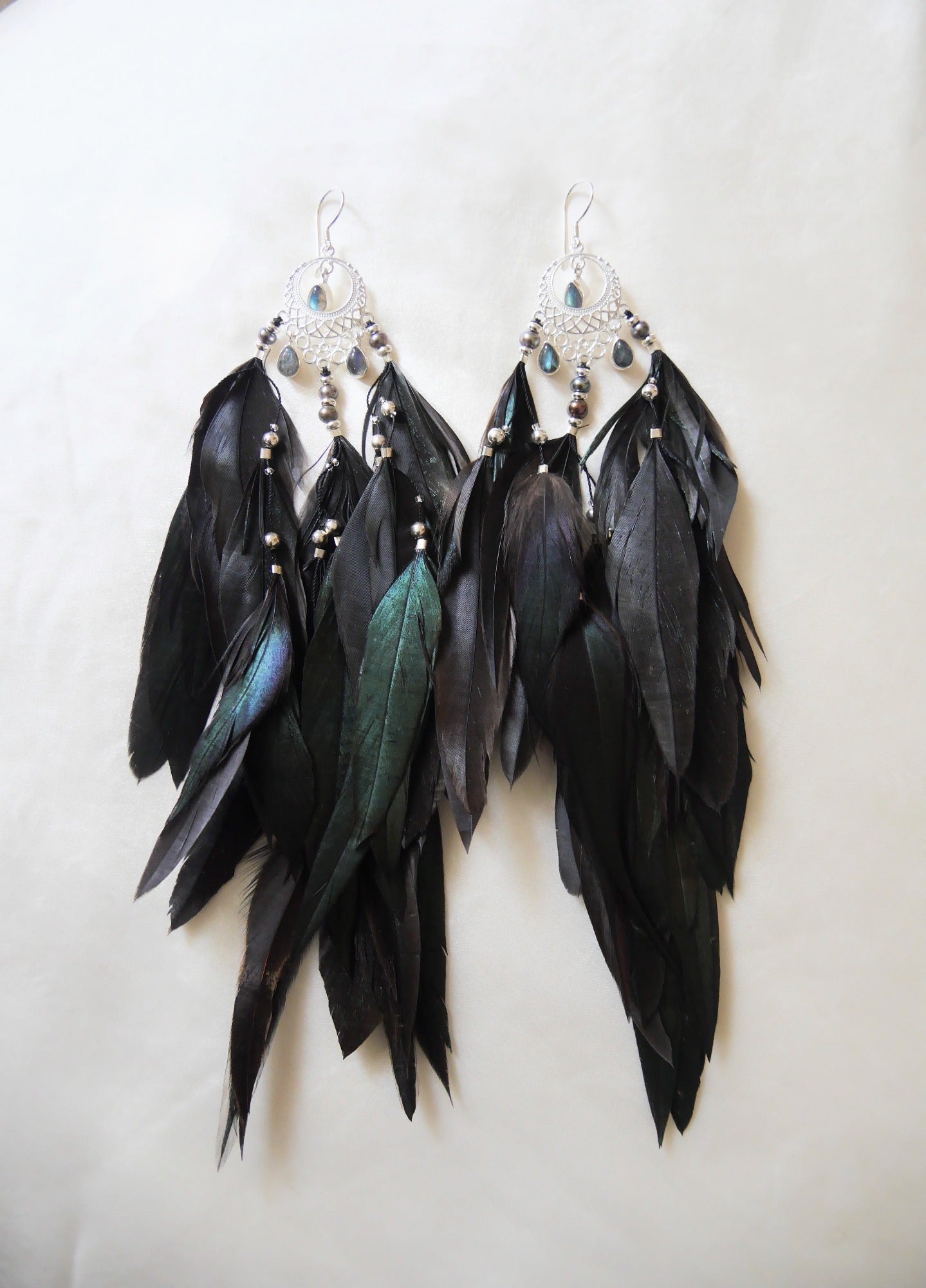 Bohemian Goddess short black feather earrings with silver moon chandalier.