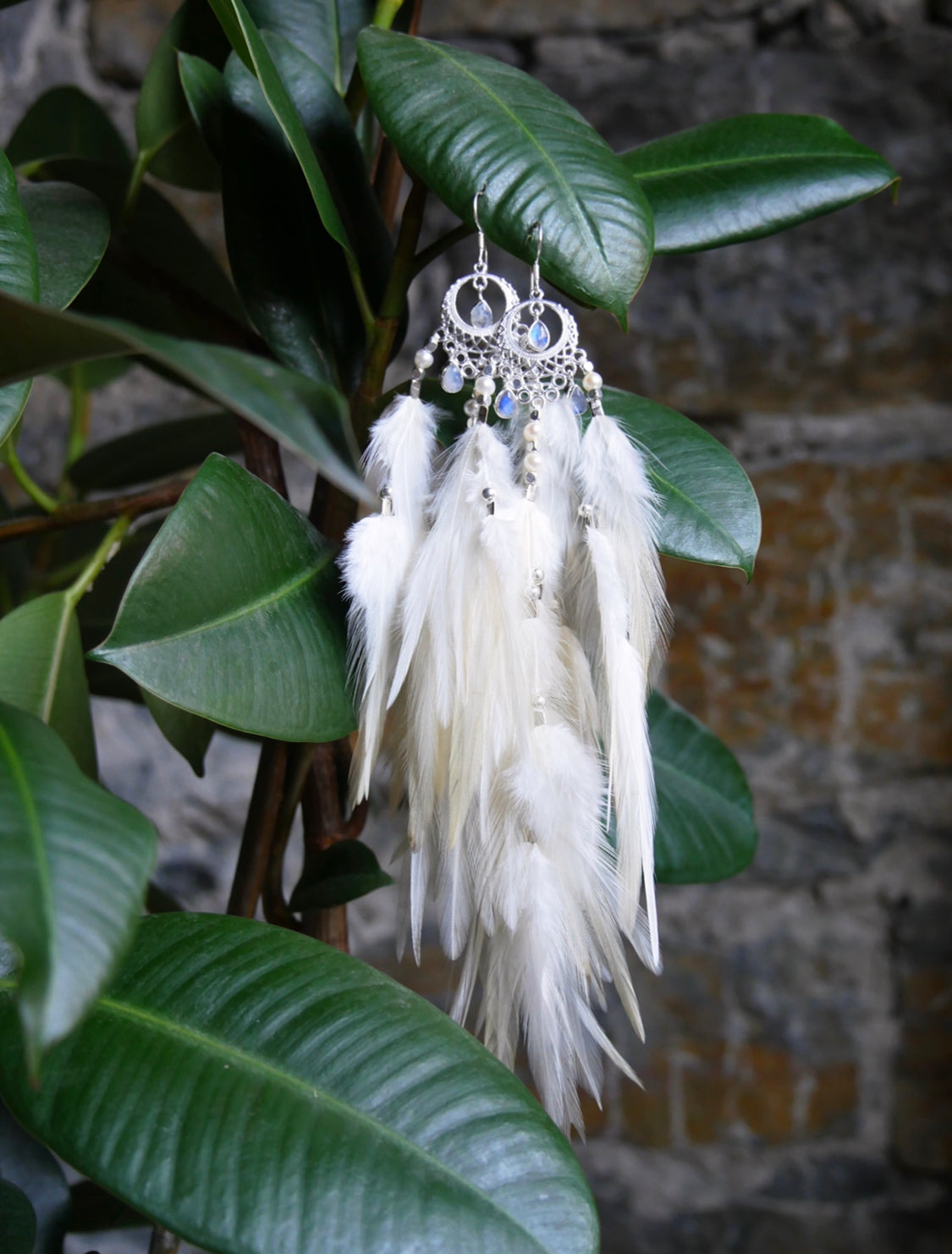 White rooster feather earrings with moonstone stones and silver accents — feminine essence jewelry