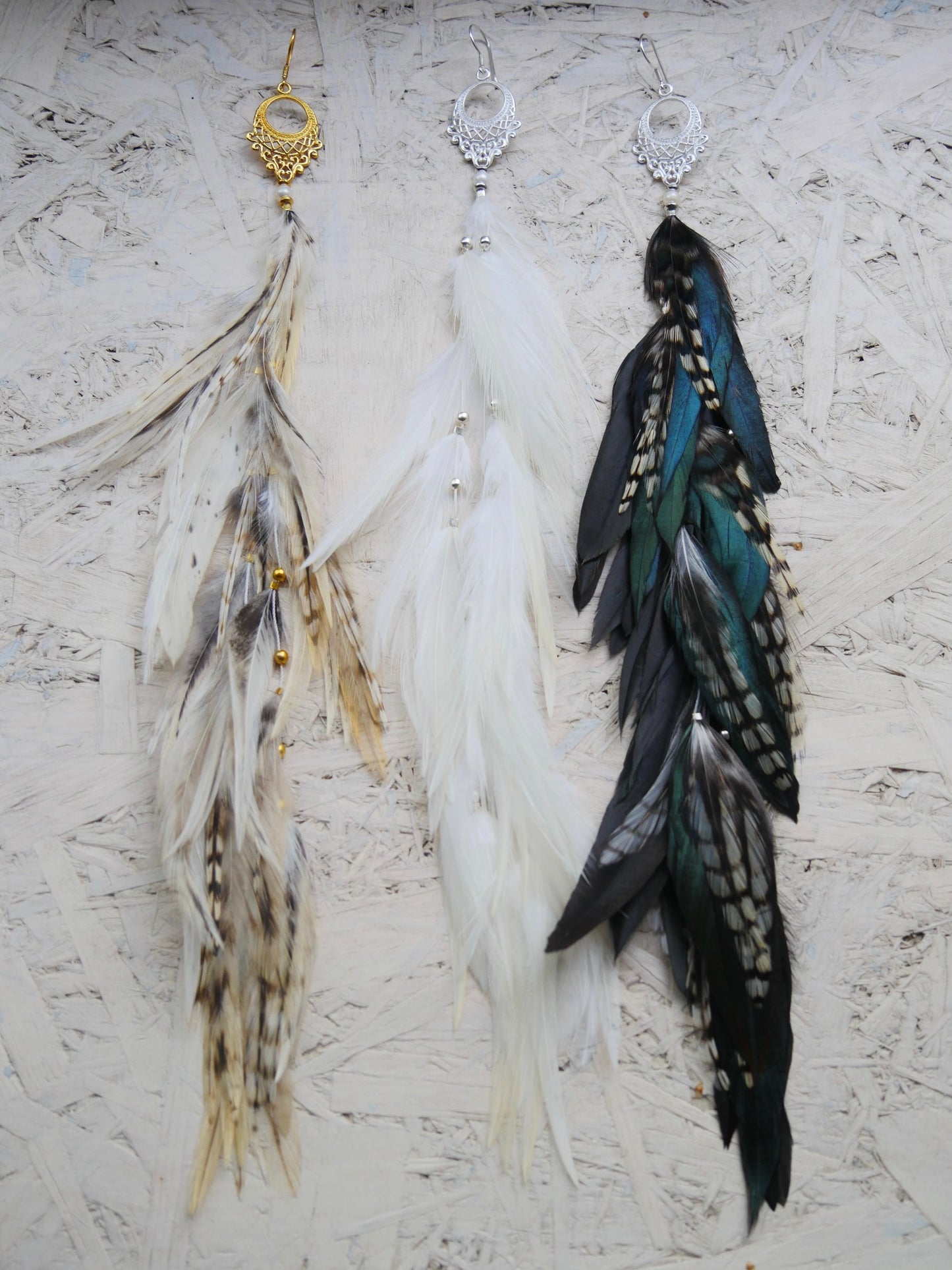  Three long single feather earrings with moon charms — asymmetrical statement goddess jewelry - the color trinity.